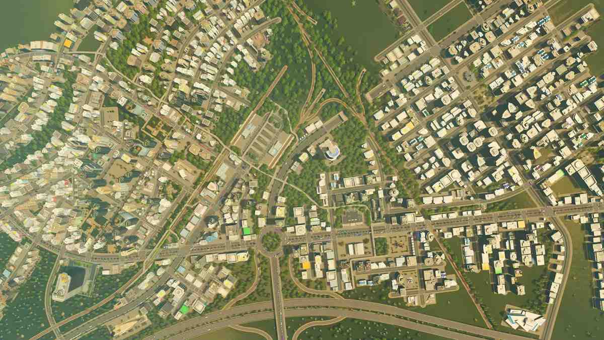 نظرة عامة من زاوية مرتفعة لتخطيط مدينة كثيف يضم طرقاً ومباني سكنية وتجارية في Cities: Skylines